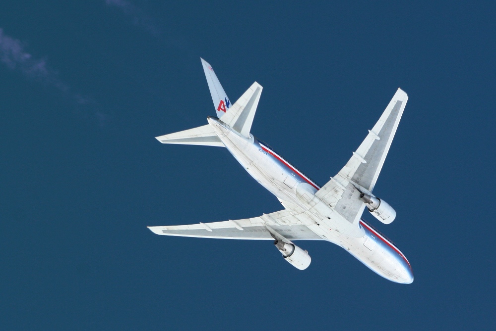 American 767-323 over Logan Tower