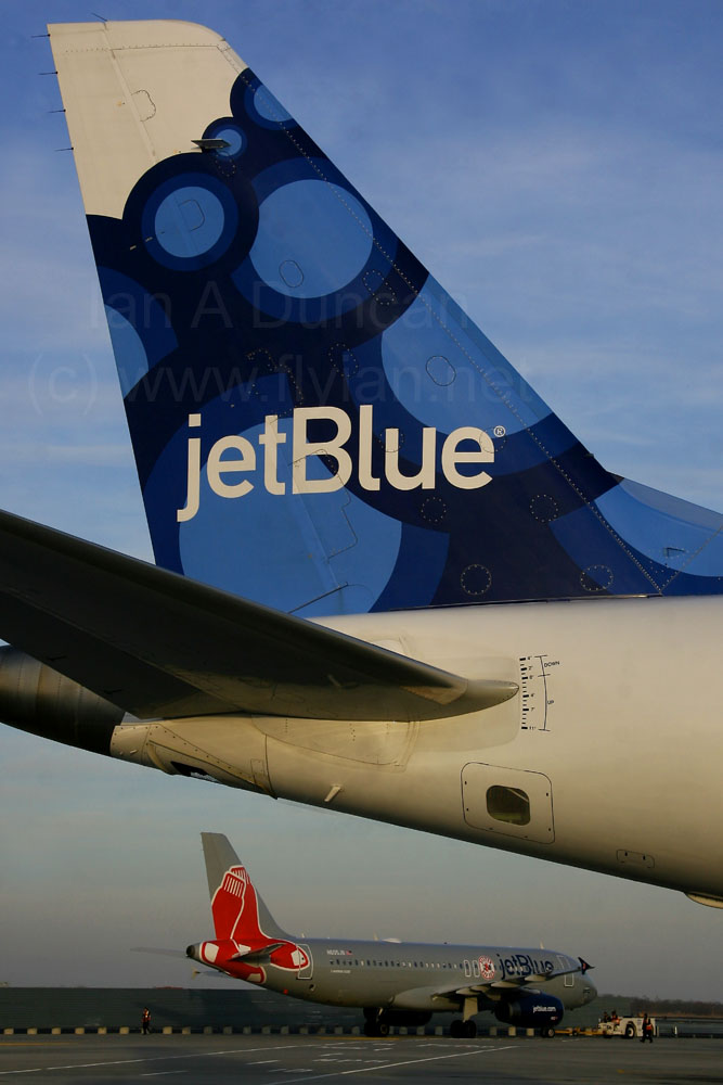 JetBlue Embraer E-190 tail and Red Sox Airbus A-320 at JFK