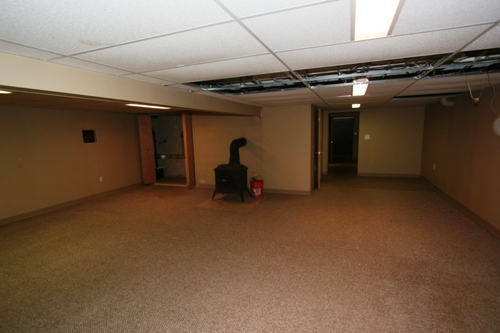 Finished basement looking back towards garage