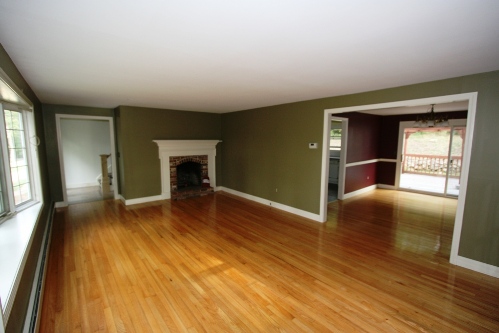 Living room looking towards fireplace, stairs