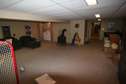 Finished basement looking back towards garage