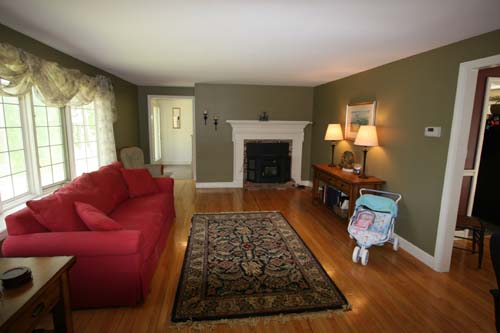 Living room looking towards fireplace, stairs